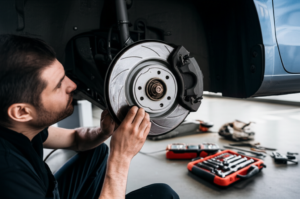 Professional mechanic inspecting brake system components at Hyperion Auto Repair brake repair service in Los Angeles