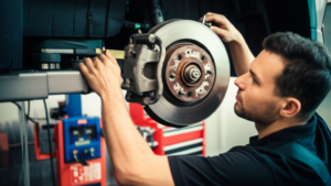 Professional mechanic inspecting and resurfacing brake rotors at Hyperion Auto Repair in Los Angeles
